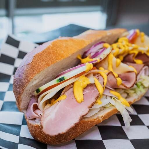 Turkey sub with mustard and red onion